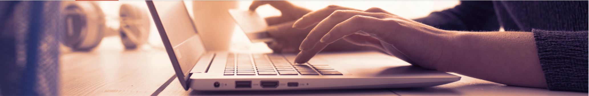 Hands writing on a laptop