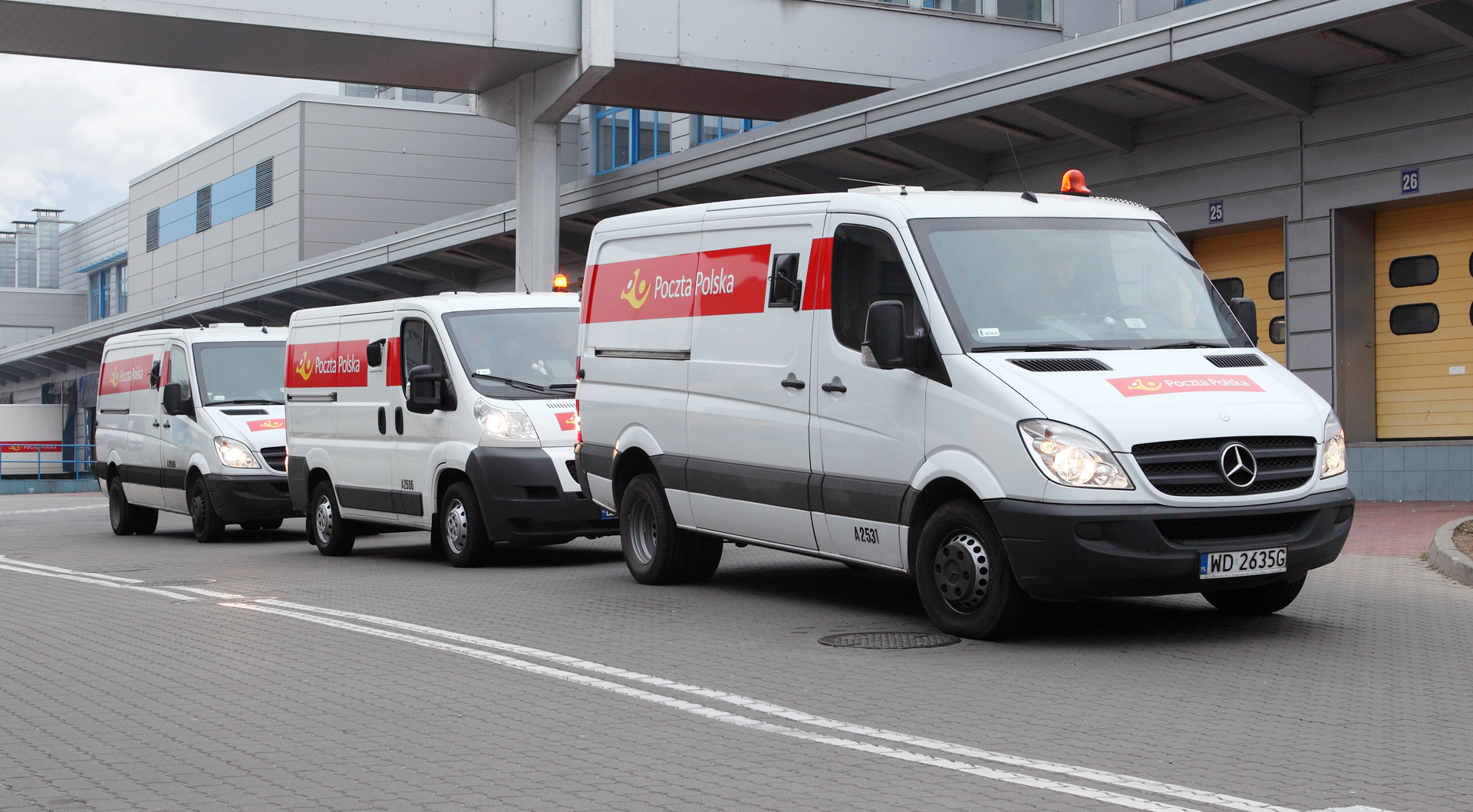 Three cars with the logo of Poczta Polska