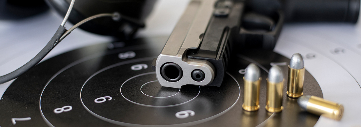 Ammunition pistols on a paper shooting shield